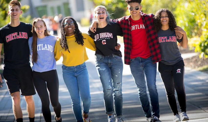 students in a line with Cortland shirts of every color